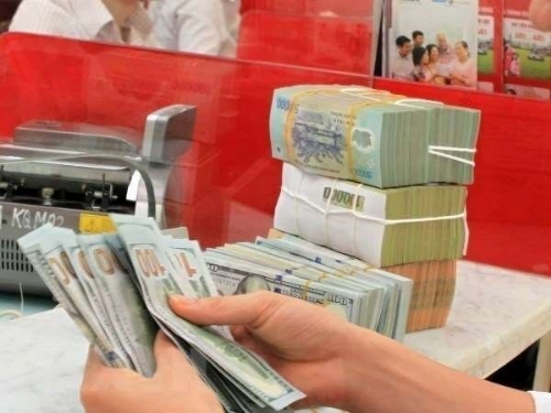 Reference exchange rate down 23 VND on January 21